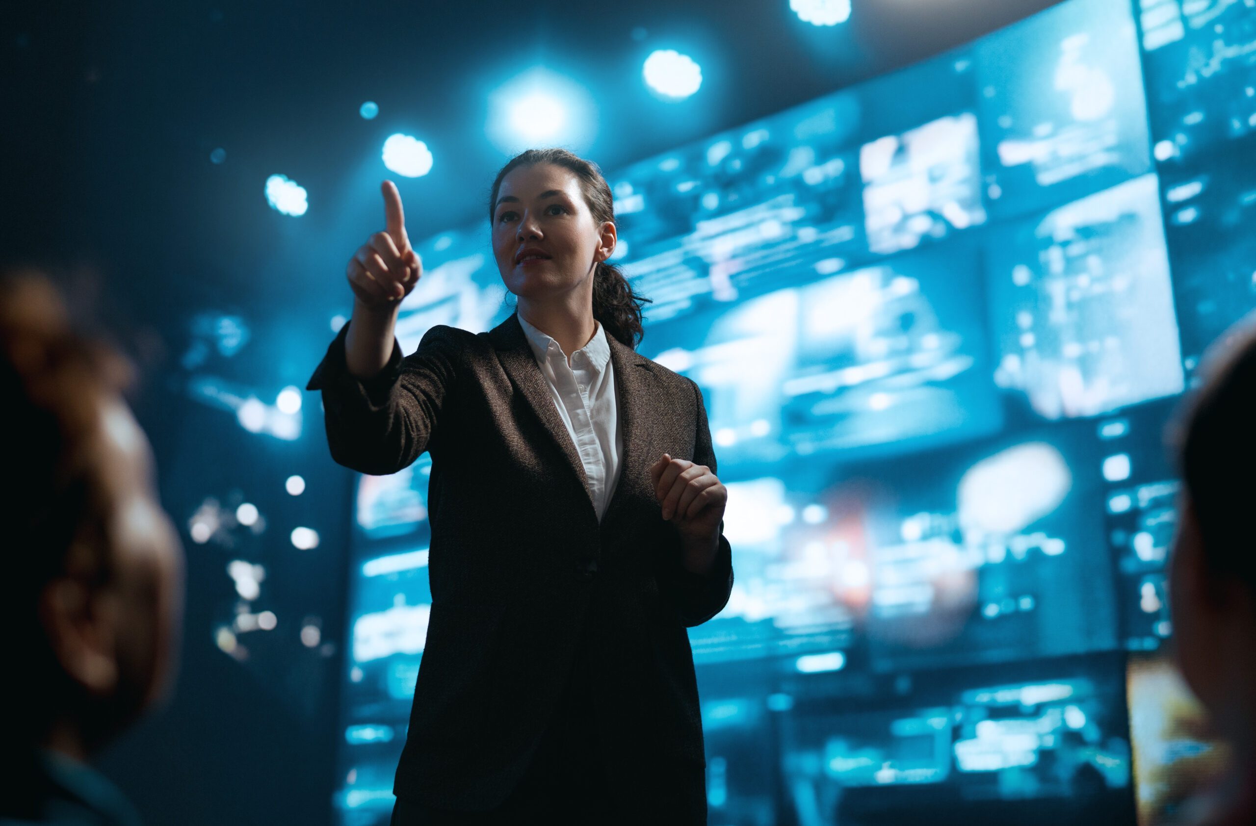 A woman is speaking on stage